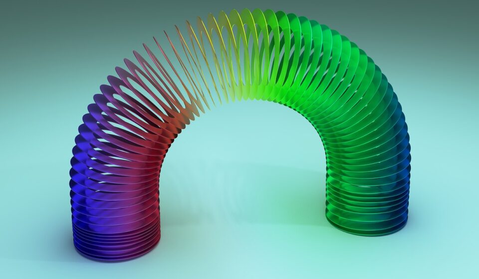 slinky, spring, rainbow, colorful, metallic, reflect, stretch, stretching, curve, flexible, coil, toy, elasticity, arch, closeup, macro, spectrum, spiral, tension, twisted, 3d, nature, play, circle, helix, vibrant